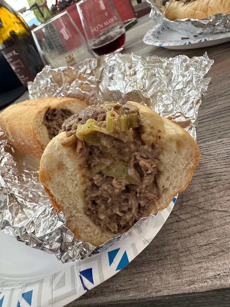 An end-on view of half a cheesesteak, wrapped in
foil